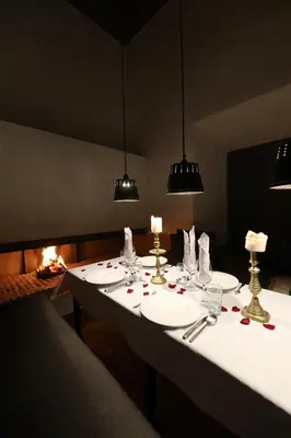 a white table with glasses and candles on it at Riad Zaouia 44 in Marrakech