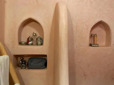 a shower in a bathroom with two arched windows at Riad 58 Blu in Marrakech