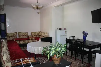 a living room with a couch and a table at Rue Riad Zitoun el Jdid in Marrakech