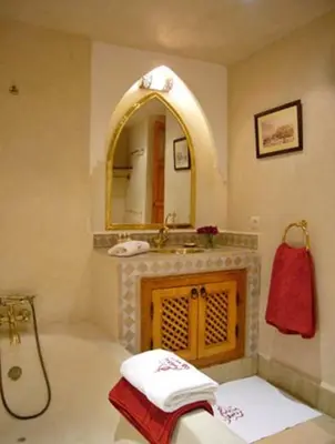 a bathroom with a sink and a mirror at Riad Rabahsadia in Marrakech