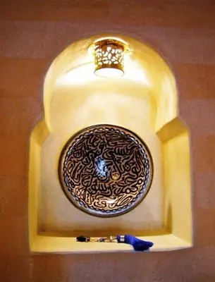 a bathroom sink with a mirror and a light at Riad Rabahsadia in Marrakech