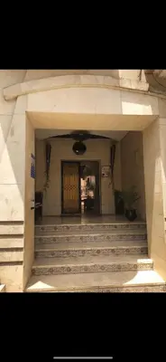 an entrance to a building with a door and stairs at Studio au centre wifi Clim in Marrakech