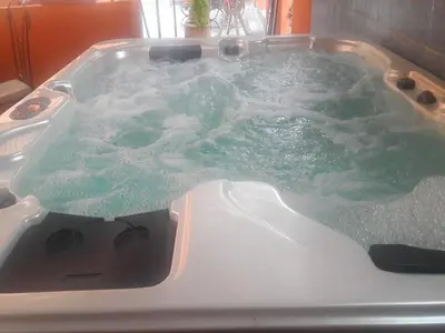 a bath tub with green water in it at Appartements Ziad Guéliz in Marrakech