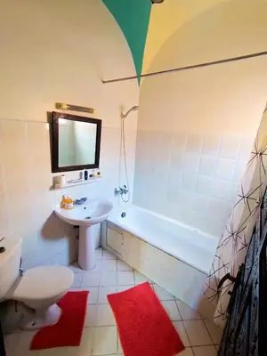 a bathroom with a tub and a sink and a toilet at Riad Zahra Marrakech Piscine in Marrakech