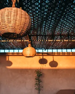 a room with two wicker baskets hanging from a ceiling at Riad Albatoul in Marrakech