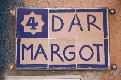 a blue and white sign on a wall at Dar Margot Marrakech in Marrakech
