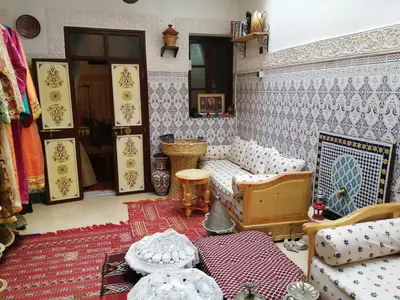 a living room with a couch and a table at Dar Margot Marrakech in Marrakech