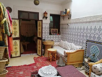 a living room with a couch and a table at Dar Margot Marrakech in Marrakech