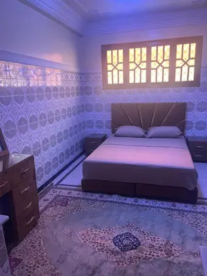 a bedroom with a bed and a window at GoodLife House in Marrakech