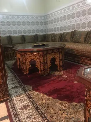 a living room with a couch and a coffee table at GoodLife House in Marrakech