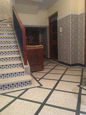 a room with a staircase and a tiled floor at GoodLife House in Marrakech
