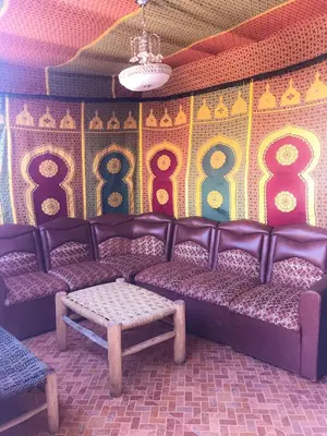 a room with chairs and a wall with numbers on it at Hostel Dream belko in Marrakech