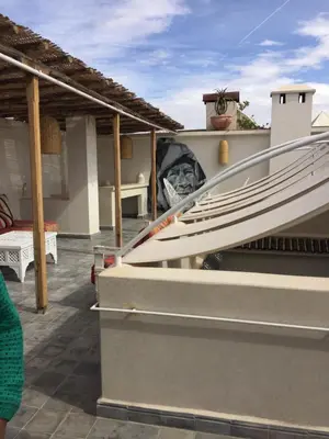 a boat sitting on the roof of a house at EDEN KAM Riad in Marrakech