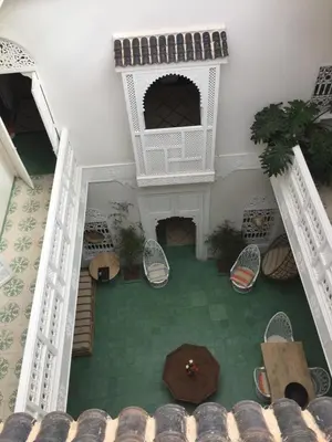 an overhead view of a courtyard with a table and chairs at EDEN KAM Riad in Marrakech