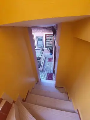 an overhead view of a staircase in a house at Riad 112 in Marrakech