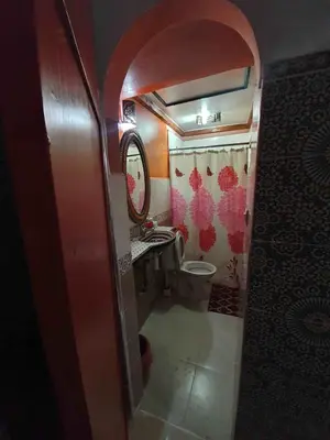 a small bathroom with a toilet and a sink at Riad 112 in Marrakech