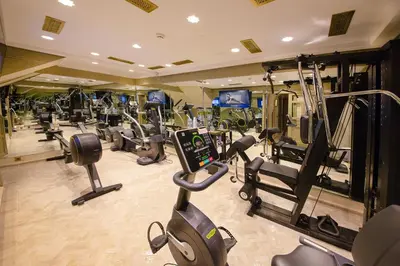 a gym with several treadmills and cardio machines at Elegancia Riad Boutique & SPA in Marrakech
