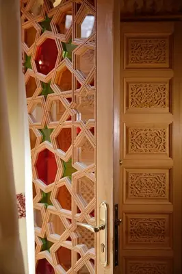 a door with a patterned wall behind it at Elegancia Riad Boutique & SPA in Marrakech