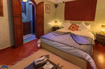 a bedroom with a large bed in a room at Riad Zen House in Marrakech