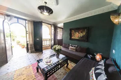 a living room with a couch and a table at Riad Mur Akush in Marrakech