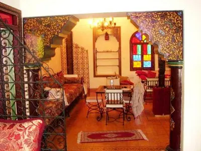 a living room with a staircase and a living room with at Silia in Marrakech