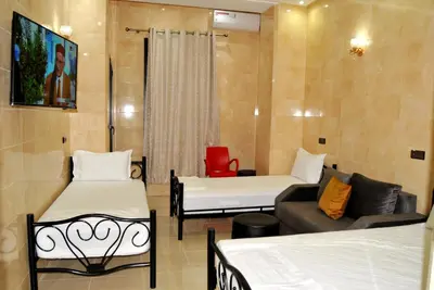 a living room with two beds and a couch at Silia in Marrakech