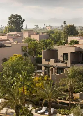 a view of a city with palm trees and buildings at Four Seasons Resort Marrakech in Marrakech