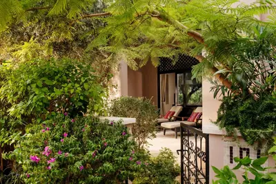 a garden with plants and flowers on a balcony at Four Seasons Resort Marrakech in Marrakech
