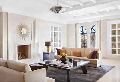 a living room with a couch and a coffee table at Four Seasons Resort Marrakech in Marrakech