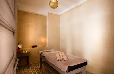 a bedroom with a bed with towels on it at Hotel & Spa Riad Al Jazira in Marrakech