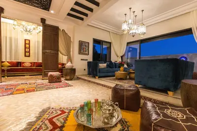 a living room with a couch and a table at VILLA ILYANA in Marrakech