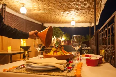 a table with a bowl of food on a table at Riad Melhoun & Spa in Marrakech