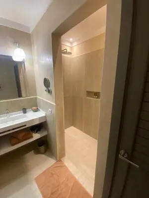 a bathroom with a shower and a sink at Riad Dar 73 in Marrakech