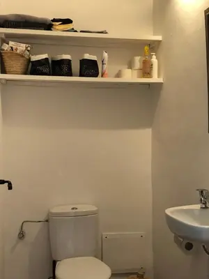 a bathroom with a toilet and a sink at Dar Christine in Marrakech