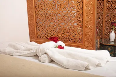 a group of towels sitting on top of a bed at Riad Daria Suites & Spa in Marrakech