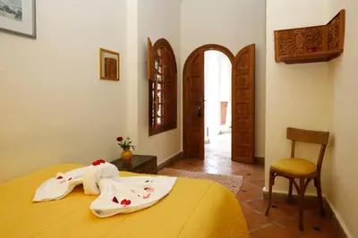 a bedroom with a bed with towels on it at Riad Daria Suites & Spa in Marrakech
