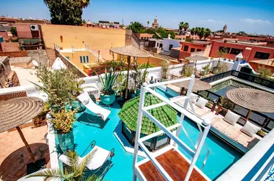 an aerial view of a resort with a pool at Hotel & Spa Riad Dar El Aila in Marrakech