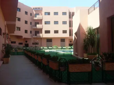 a swimming pool in the middle of a building at LINA APPARTEMENT in Marrakech