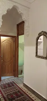 a room with a door and a mirror on a wall at Dar HAJAR in Marrakech