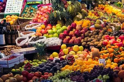 a display of fruits and vegetables in a market at Riad Safae in Marrakech