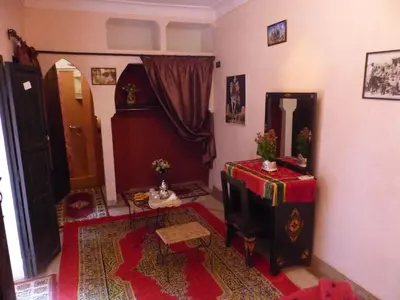 a living room with a room with a table and a room at Riad Jakoura in Marrakech