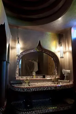 a bathroom with a sink and a mirror at Riad Granvilier in Marrakech