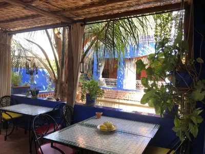 a table with bananas on it in a restaurant at Riad Alamine in Marrakech