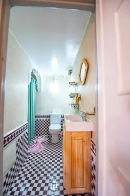 a bathroom with a sink and a toilet in it at KOUTOBIA ROYAL in Marrakech
