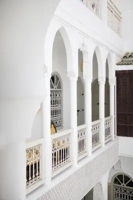 a white building with arches and windows at Riad Oriental Glory & Spa in Marrakech