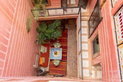 a door of a building with a plant on it at Riad N10 in Marrakech