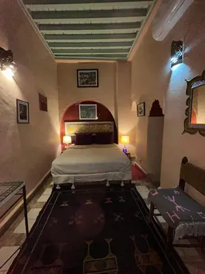 a bedroom with a bed in a room at Riad N10 in Marrakech