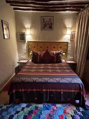 a bedroom with a bed in a room at Riad N10 in Marrakech