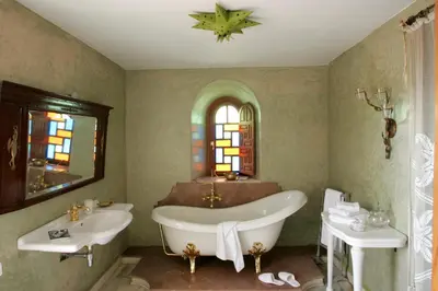 a bathroom with two sinks and a bath tub and a tub at Casa Taos in Marrakech