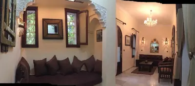 a living room with a couch in the middle of a room at Riad Dar El Assafir in Marrakech